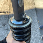 Lowering ring fitted under rear shock spring
