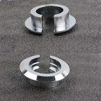 Two silver shock lowering spacer rings
