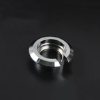 Silver suspension lowering ring on black background