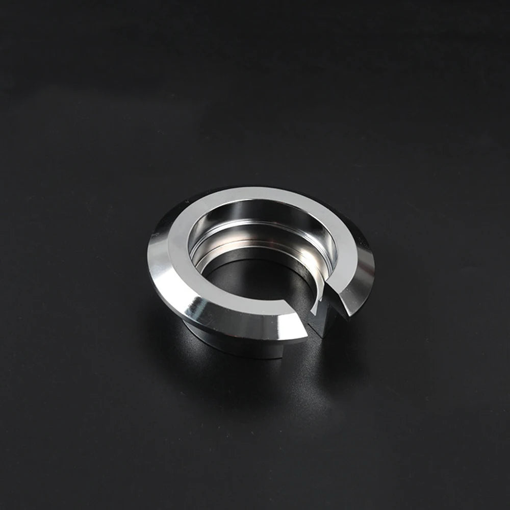 Silver suspension lowering ring on black background