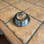 Rear shock lowering ring on tiled floor
